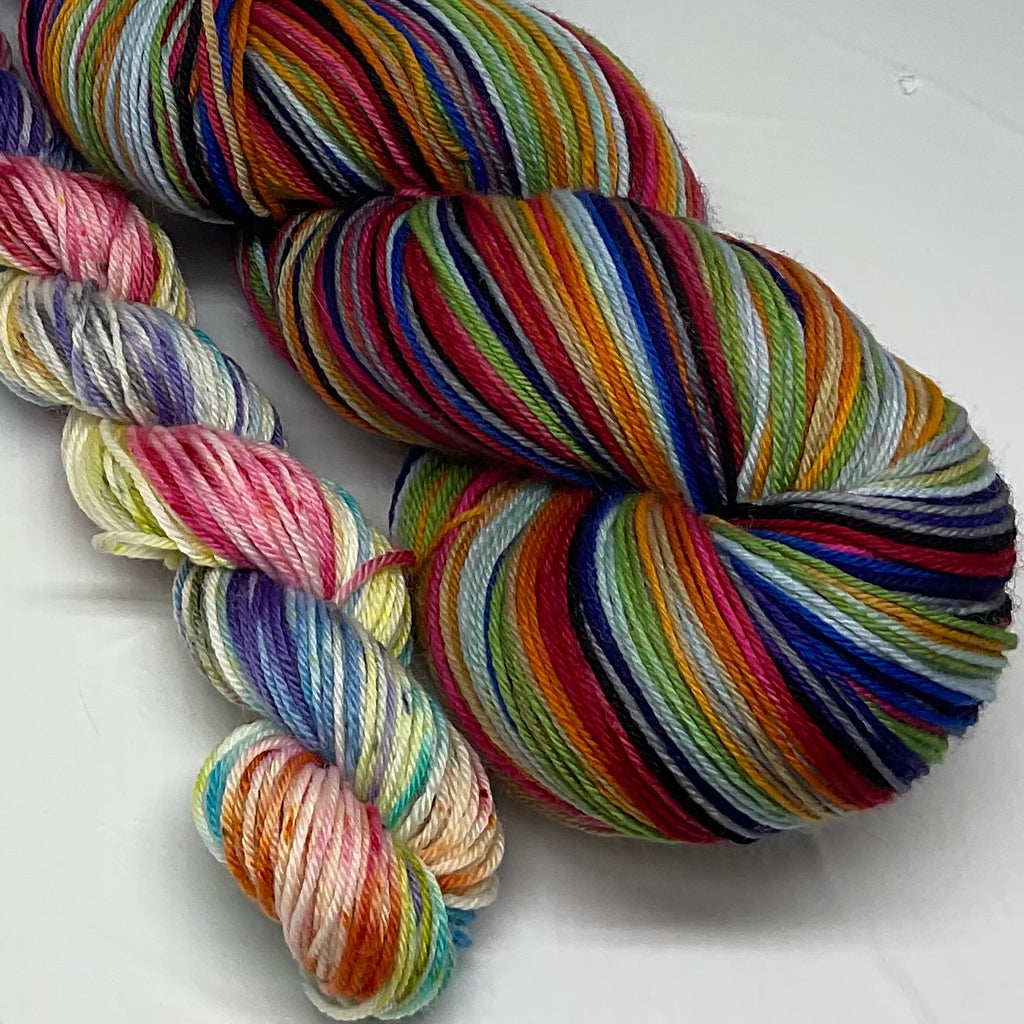 Rainbow Pantsuits Twelve Stripe Self Striping Yarn with Coordinating Speckled Mini Skein